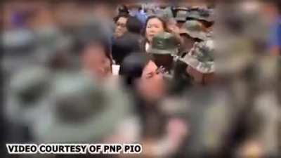Philippines: Duterte's wife smacks a police officer with her phone after they stop her from visiting her husband, who was arrested for crimes against humanity.