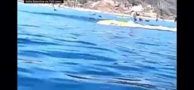 A whale swallowing two people on a canoe (not OC)
