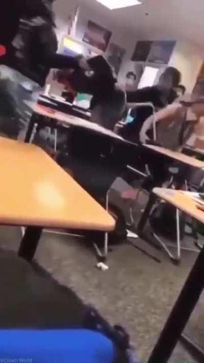 Student slams a teacher's head with a chair