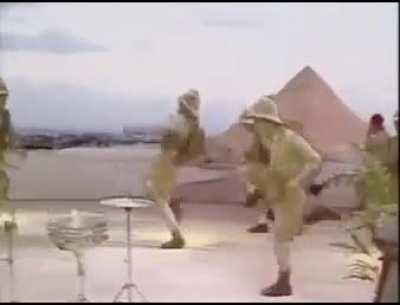 Ooger sit on rock in front of cave when these tribesmen come and speak but Ooger no understand what say. Other tribesmen offer Ooger shiny rock so Ooger accept but tribesmen take Ooger's cave drawings and use weird rocks that make sound afterwards. What O