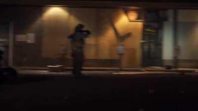 Minneapolis police pull up on looters at a liquor store