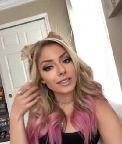 Alexa Bliss kisses.