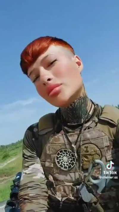 ru pov: Ukrainian paramedic sporting a Black Sun and a Totenkopf style patches.