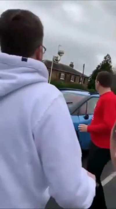 The driver ran over an employee, then people damaged her car