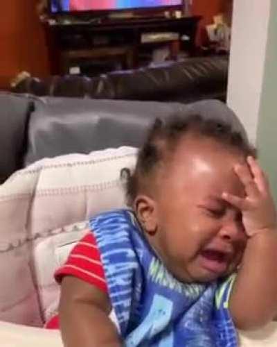 baby sees his father's new haircut