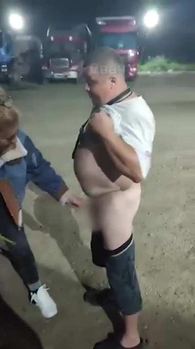 russian lot lizard (sєx worker for truckers) measures drunk guy's d*ck at 4cm. He promised her 25cm. She is not impressed.