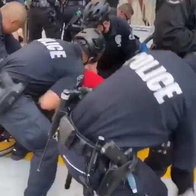 Cops assaulting BLM protesters, including a man in a wheelchair. This happened yesterday in Downtown Los Angeles. One of the people injured in by police even had a seizure. Meanwhile, complicit media reported the arrested individuals (including the wheelc