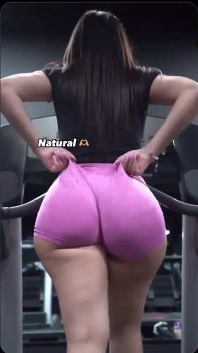 Thicc girl in pink shorts walking on treadmill