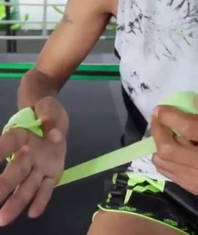 Muay thai champion wrapping his hand 