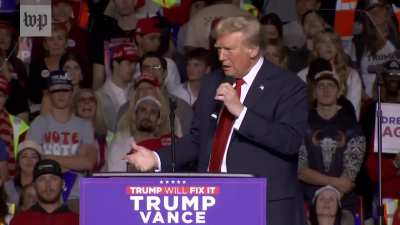 Trump mimes a blowj*b as he vents about his microphone setup at a rally on 11/01/2024