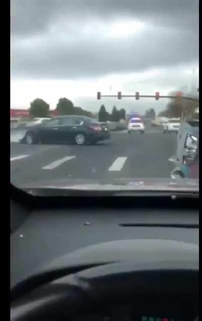 It's fun to film a police chase! (The guy filming is NOT the idiot.)