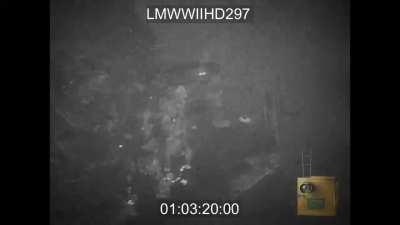 German tracer fire rises up to meet Allied bombers hitting a port on the French Coast - 1944