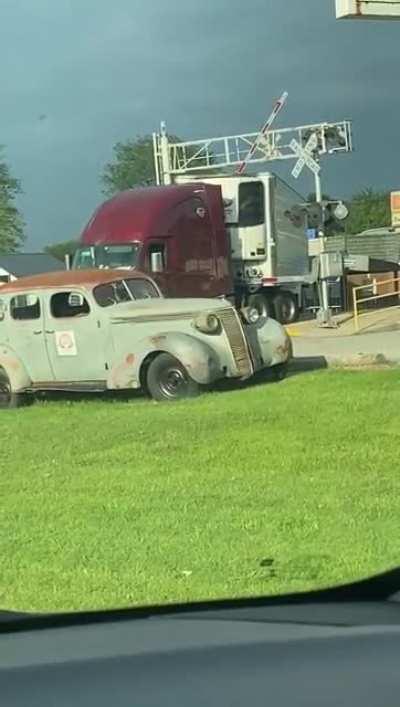 Semi truck got stuck on tracks nearby.