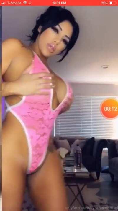 Twerking in a pink one piece