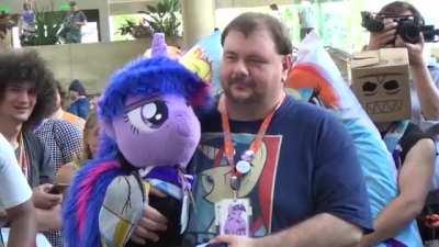 People marrying My Little Pony body pillows and plushies at a convention