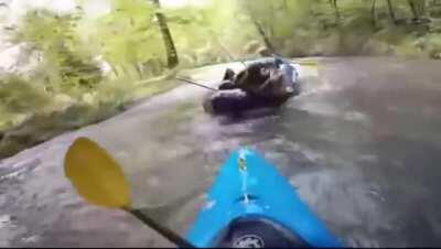 Two women fighting while river rafting