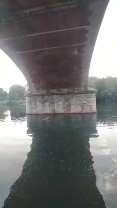 Under a bridge in Turin Italy, saxophonist Frankye Laforgue performs 