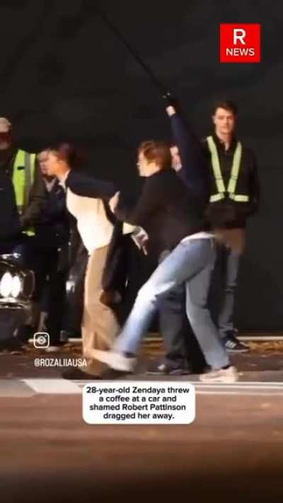 Zendaya throws coffee at car, before being dragged away by Pattinson.