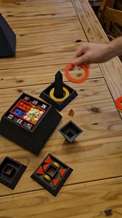 A mysterious pyramid table game tower! Designed and printed by me.