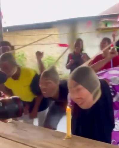 Competitive candle blowing at a birthday party?