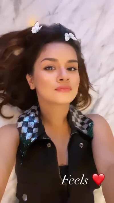 She reaches to take her top off for all her followers but then remembers that she has friends and family following her