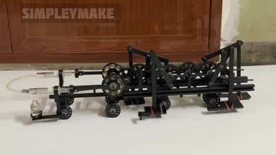 Stirling engine runs chebyshev lambda walking mechanism using compound gear ratio
