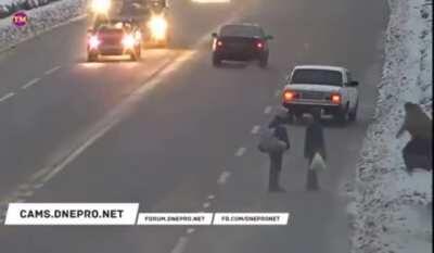 Guy almost runs over animal on a icy road because of jaywalkers then applies some Russian justice
