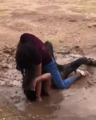 Girlfight in mudwater