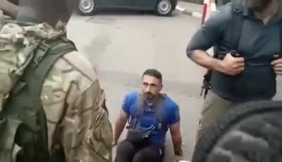 Congolese M23 rebel officer berates european mercenaries that surrendered.