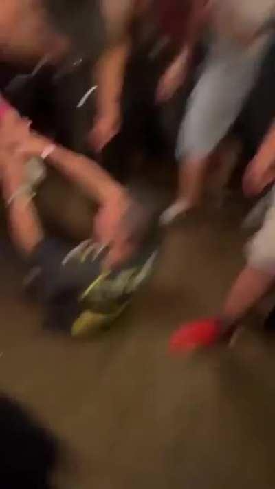 Throwing a bottle at a group of people and provoking them at Astroworld