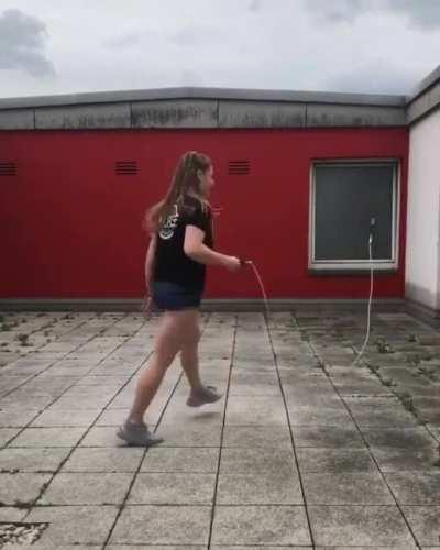 Girl jump roping, beautifully