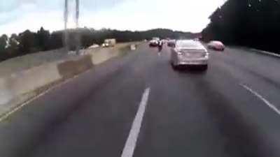 Bikes pass between cars in traffic
