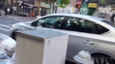 This woman shows her tits in the street without any problems