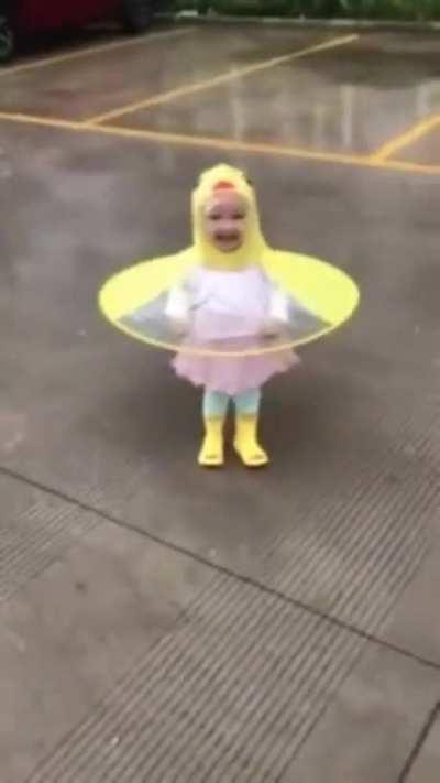 A cute little ducky enjoying the rain.