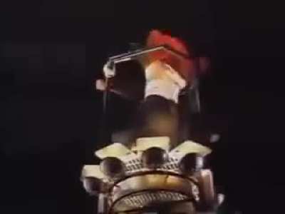 Guy jumps on crane with Michael Jackson during performance