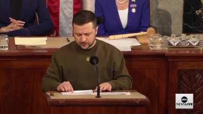Pres. Zelenskyy ends his address to Congress by displaying a battle flag given to him by soldiers on the front line. “This flag is a symbol of our victory...We stand, we fight, and we will win because we are united. Ukraine, America, and the entire free w