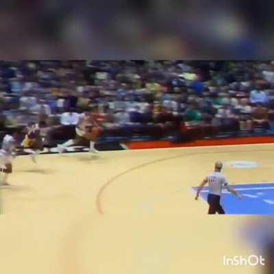 Dr. J realizing he was one step away from a travel does a 'Rock The Baby' cradle dunk