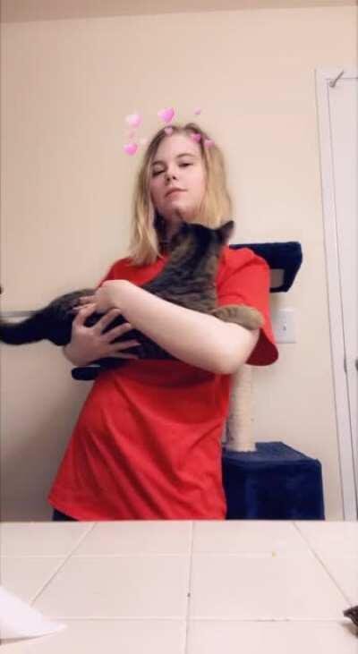 Kinda embarrassing video of me BUT my 16/17 pound 7 month old kitten (he’s HUGE) still wants to be held like a baby. He’s too big for me to flip him like I used to so now he climbs me and slides down until I catch him. Finally got a video
