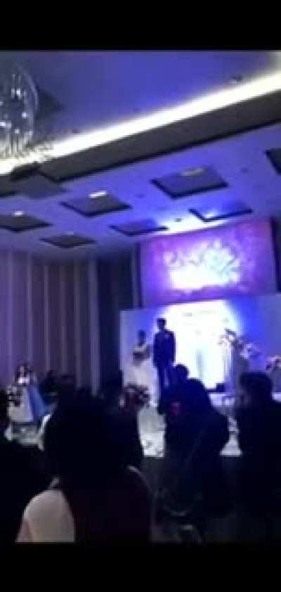 A man at his wedding plays a video in which his wife cheats on him.