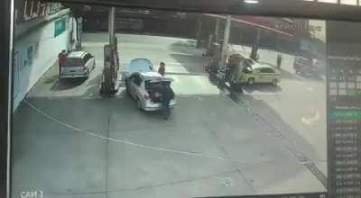 Car explodes at a gas station