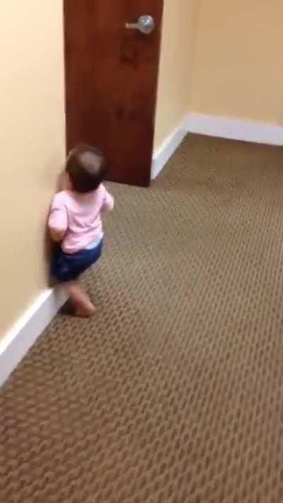 Baby runs into wall learning to walk..