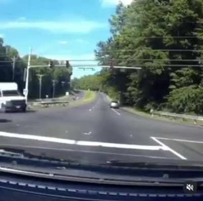 Motorcyclist threads the needle of death