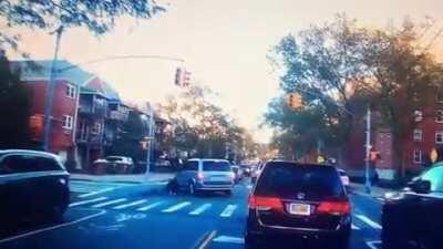 Guy on bike flips off driver then immediately crashes