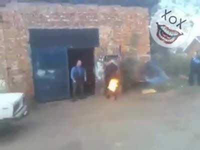 New game in Russia, drunk farting onto a fire.