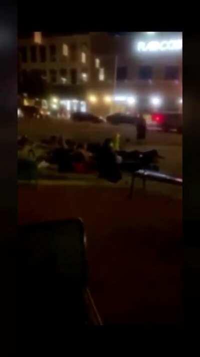 Kalamazoo, Michigan - Protesters lying on ground shot at with tear gas and pepper spray