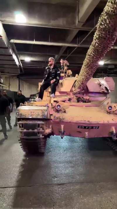 Jake Paul arriving on a gigantic tank ahead of the Nate Diaz fight