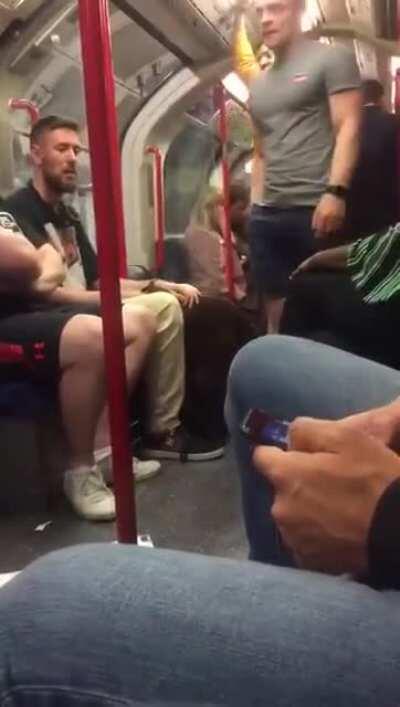 Loud association football fan getting kicked off the tube