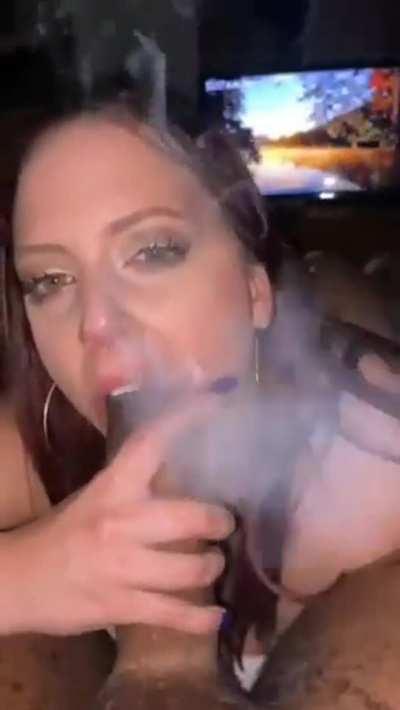 Smoking a joint and deepthroating a black cock