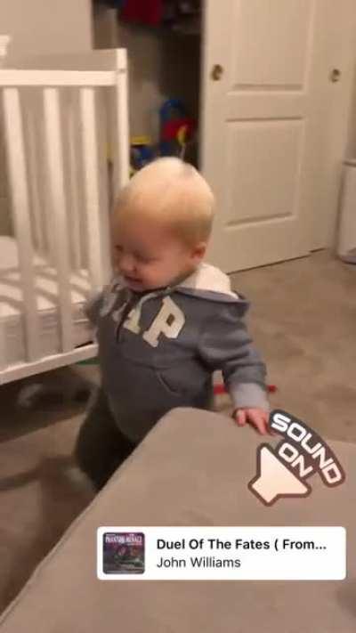 Toddler dramatically dies in lightsaber duel