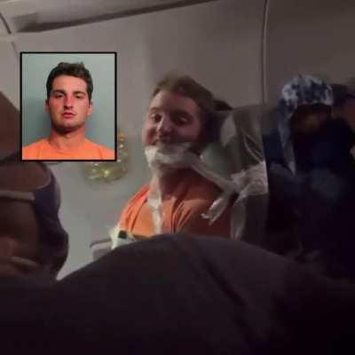 lol look at this shit yall he was grabbin titties on the plane and punch 1 of the ladies so they tied his ass up